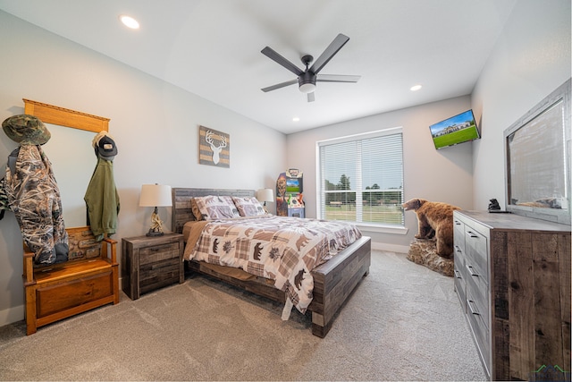 bedroom featuring ceiling fan and light carpet