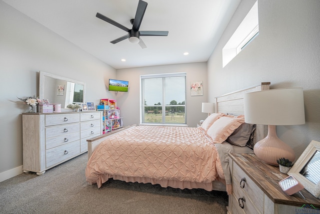 carpeted bedroom with ceiling fan and multiple windows