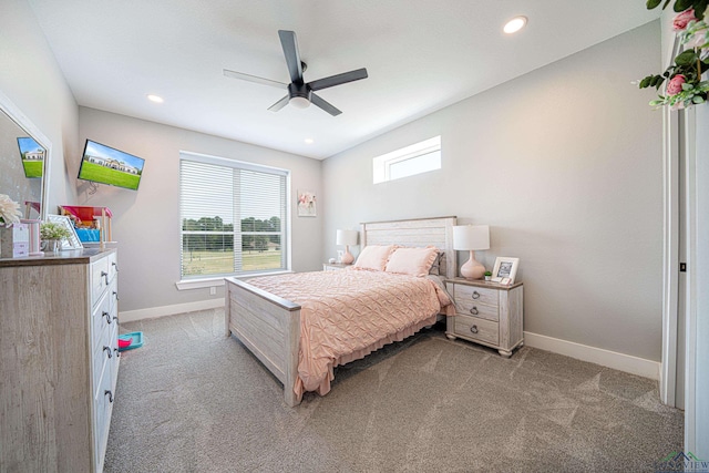 bedroom with ceiling fan and light carpet