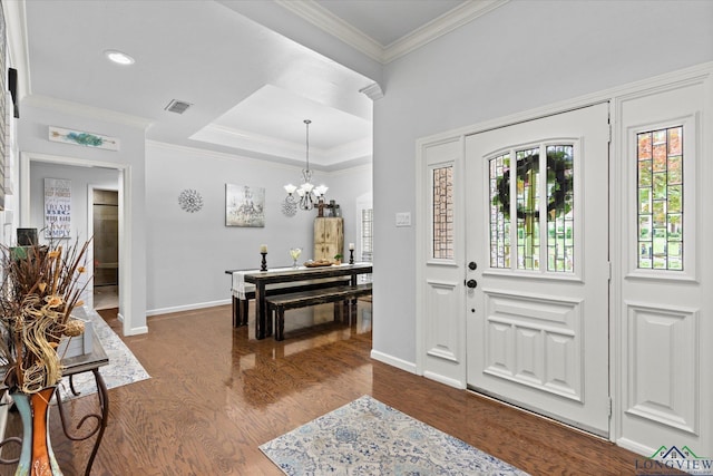 1312 Enchanted Ln, Longview, TX 75604 - entrance foyer featuring dark wood-type flooring, baseboards, crown molding, and a chandelier