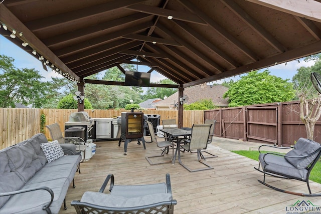 1312 Enchanted Ln, Longview, TX 75604 - wooden terrace with outdoor dining space, a fenced backyard, area for grilling, and an outdoor hangout area