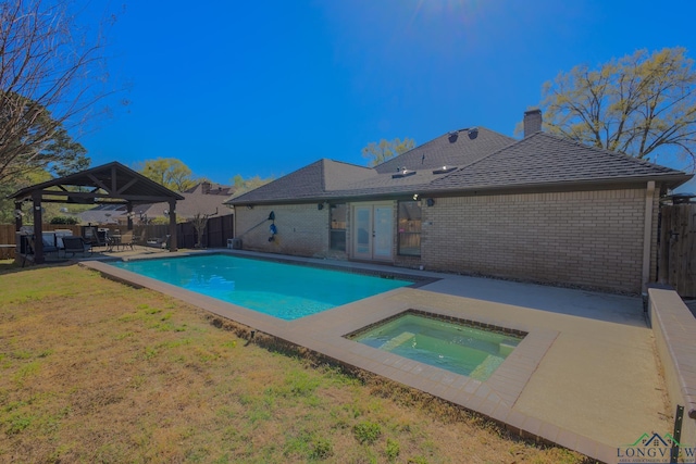 view of swimming pool featuring a fenced backyard, a patio area, an in ground hot tub, a gazebo, and french doors