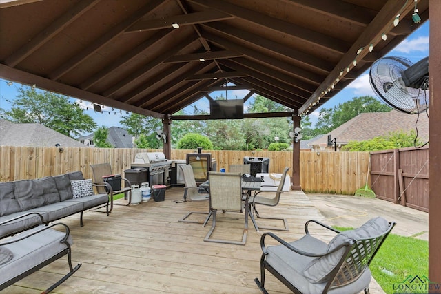 1312 Enchanted Ln, Longview, TX 75604 - wooden deck with an outdoor living space, outdoor dining area, a fenced backyard, and grilling area