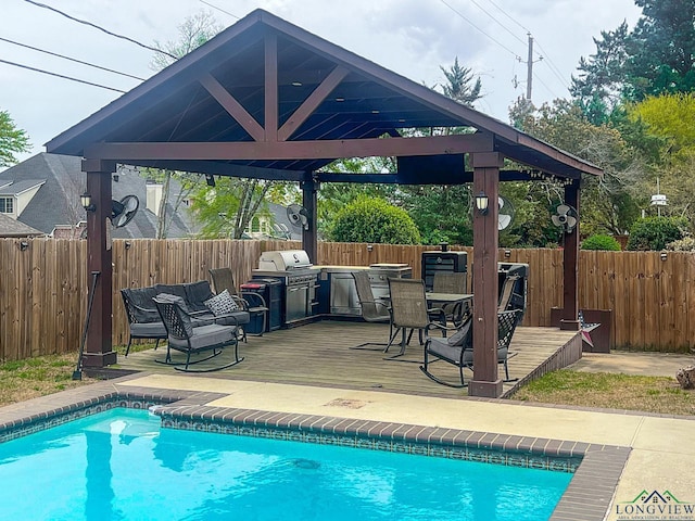 view of swimming pool featuring a fenced backyard, a gazebo, a fenced in pool, and a deck