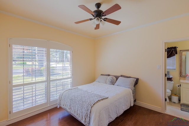 bedroom with crown molding, baseboards, ceiling fan, and wood finished floors