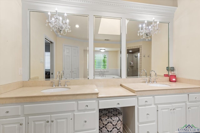1312 Enchanted Ln, Longview, TX 75604 - bathroom featuring a chandelier, a stall shower, double vanity, crown molding, and a bathtub