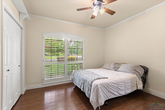 1312 Enchanted Ln, Longview, TX 75604 - bedroom featuring ornamental molding, wood finished floors, baseboards, a ceiling fan, and a closet