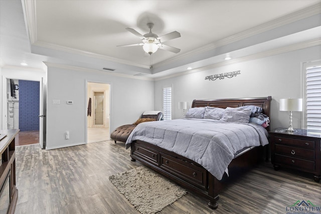 1312 Enchanted Ln, Longview, TX 75604 - bedroom featuring a raised ceiling, wood finished floors, crown molding, baseboards, and recessed lighting