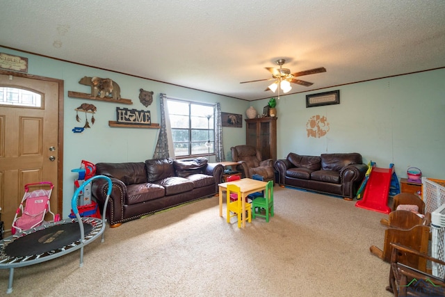 living room with carpet, ceiling fan, and a textured ceiling