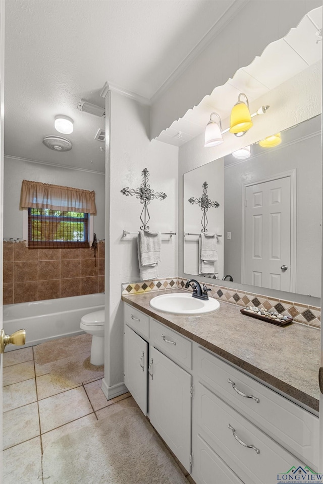 bathroom featuring crown molding, tile patterned flooring, vanity, and toilet