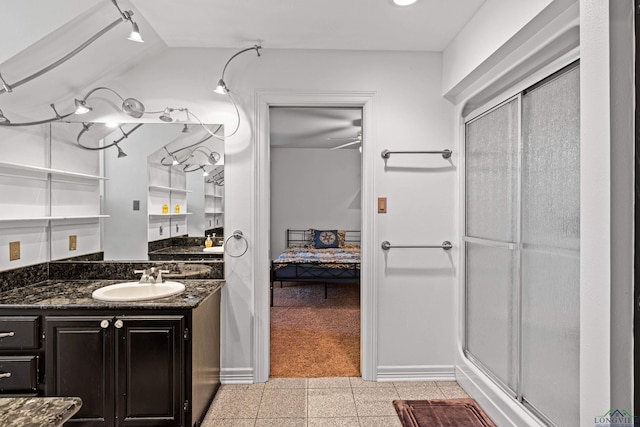 bathroom featuring lofted ceiling, vanity, an enclosed shower, and ceiling fan