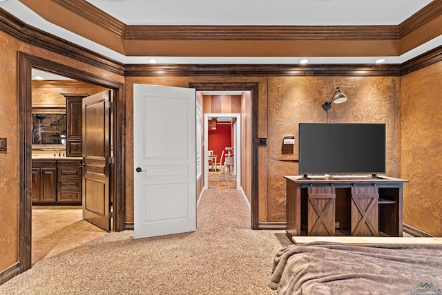 carpeted bedroom featuring connected bathroom and crown molding