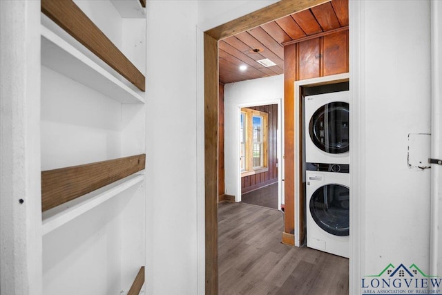 501 S Harrison St, Longview, TX 75601 - laundry area with stacked washer / dryer, wooden ceiling, and wood finished floors