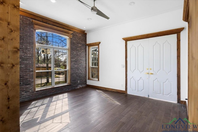 501 S Harrison St, Longview, TX 75601 - foyer entrance featuring baseboards, wood finished floors, crown molding, and a ceiling fan