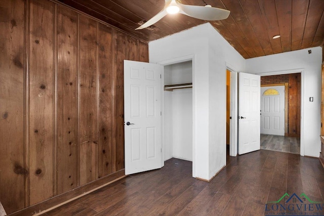 501 S Harrison St, Longview, TX 75601 - unfurnished bedroom featuring wood ceiling, dark wood-type flooring, a closet, and a ceiling fan