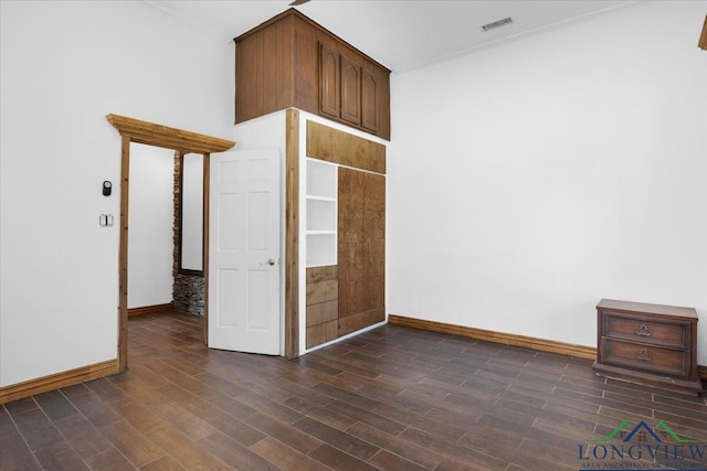 501 S Harrison St, Longview, TX 75601 - unfurnished room with baseboards, dark wood-style flooring, and ornamental molding