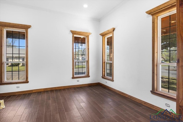 501 S Harrison St, Longview, TX 75601 - empty room with baseboards, dark wood-style flooring, and ornamental molding