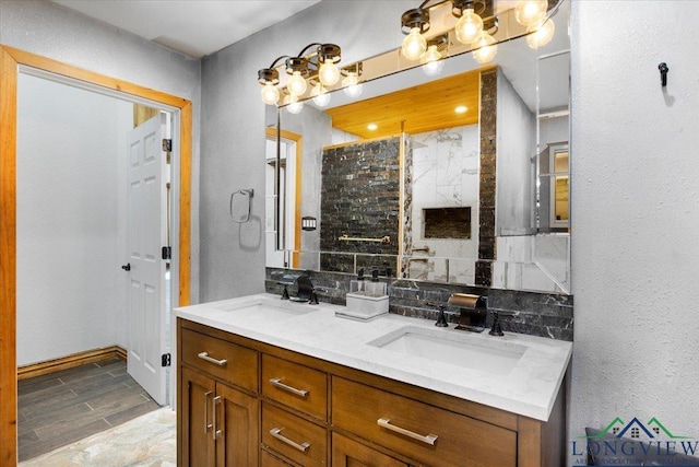 501 S Harrison St, Longview, TX 75601 - full bath with double vanity, a shower, backsplash, and baseboards