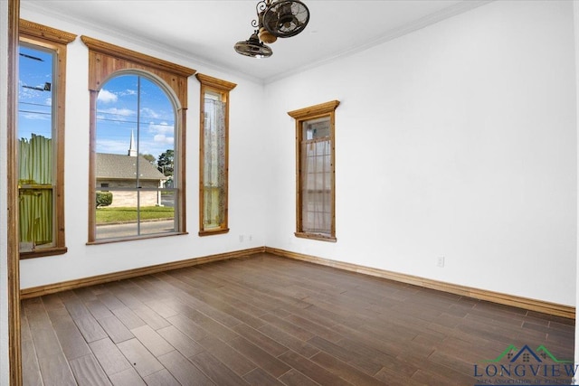 501 S Harrison St, Longview, TX 75601 - empty room featuring baseboards, dark wood-type flooring, and ornamental molding