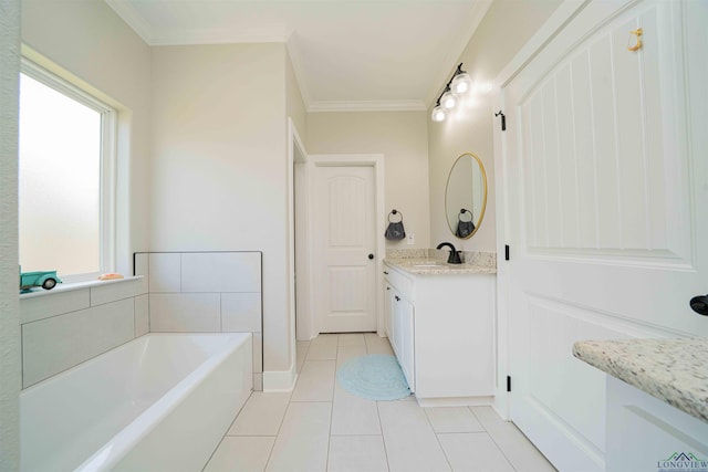 full bath featuring vanity, a garden tub, ornamental molding, and tile patterned flooring