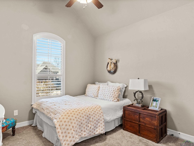 carpeted bedroom featuring ceiling fan and high vaulted ceiling