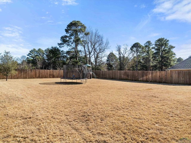 view of yard featuring a trampoline