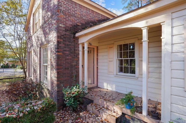 property entrance with covered porch