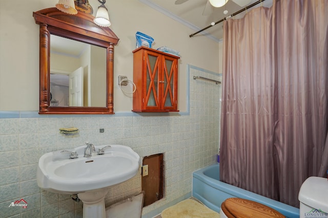 full bathroom featuring shower / bath combination with curtain, ceiling fan, crown molding, tile walls, and toilet