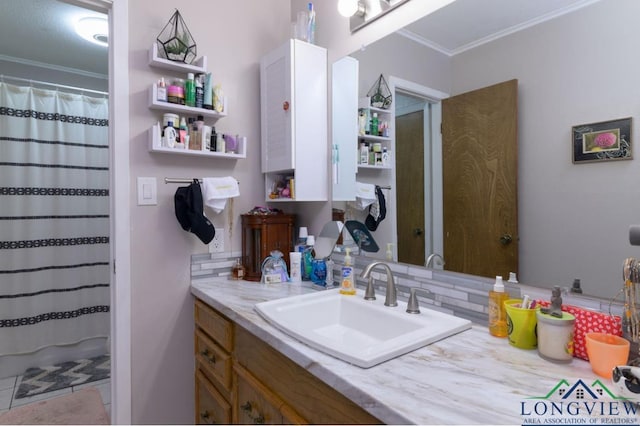 bathroom with tasteful backsplash, vanity, and ornamental molding