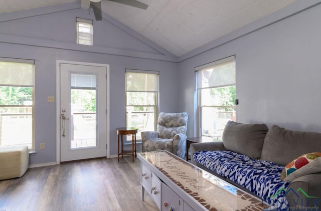 living room with vaulted ceiling, ceiling fan, and hardwood / wood-style flooring