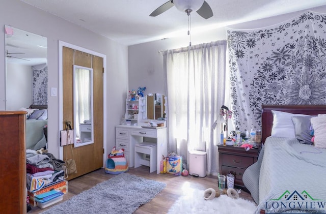 bedroom featuring ceiling fan and light hardwood / wood-style flooring