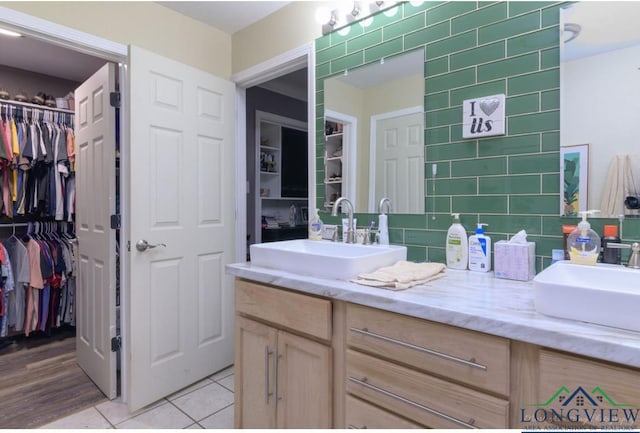 bathroom with tile patterned flooring and vanity