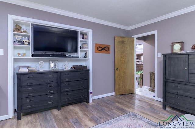 bedroom featuring ornamental molding and wood-type flooring