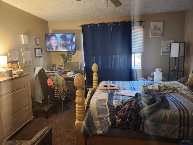 bedroom featuring carpet flooring, a textured ceiling, and ceiling fan