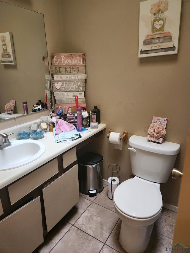 bathroom with tile patterned floors, vanity, and toilet