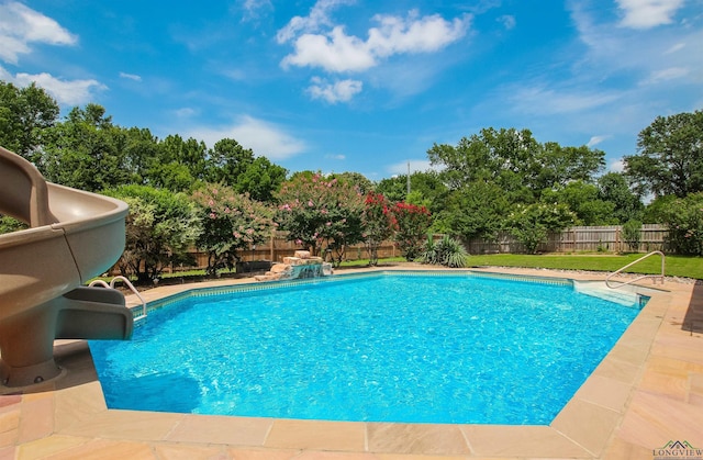 1302 Jeff Davis Dr, Tyler, TX 75703 - view of pool with a water slide and a fenced backyard