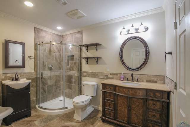 1302 Jeff Davis Dr, Tyler, TX 75703 - bathroom featuring tile walls, a shower stall, vanity, crown molding, and wainscoting