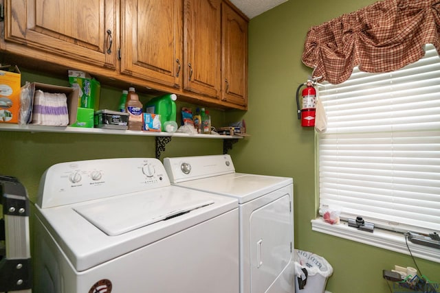 1901 Azalea St, Gilmer, TX 75644 - clothes washing area with washer and dryer and cabinet space