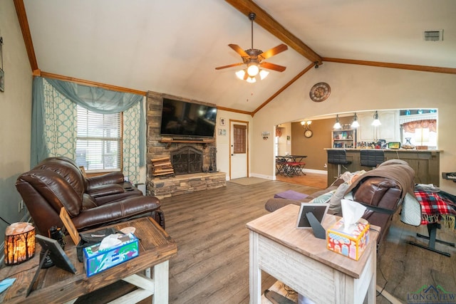 1901 Azalea St, Gilmer, TX 75644 - living room with a stone fireplace, wood finished floors, vaulted ceiling with beams, ceiling fan, and visible vents