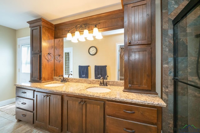 1901 Azalea St, Gilmer, TX 75644 - full bath featuring baseboards, a sink, double vanity, and tiled shower