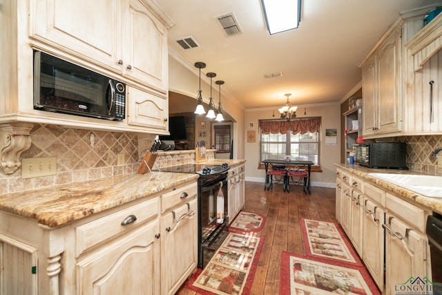 1901 Azalea St, Gilmer, TX 75644 - kitchen with black appliances, an inviting chandelier, dark wood-style floors, and visible vents