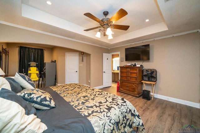 1901 Azalea St, Gilmer, TX 75644 - bedroom with a tray ceiling, wood finished floors, baseboards, and recessed lighting