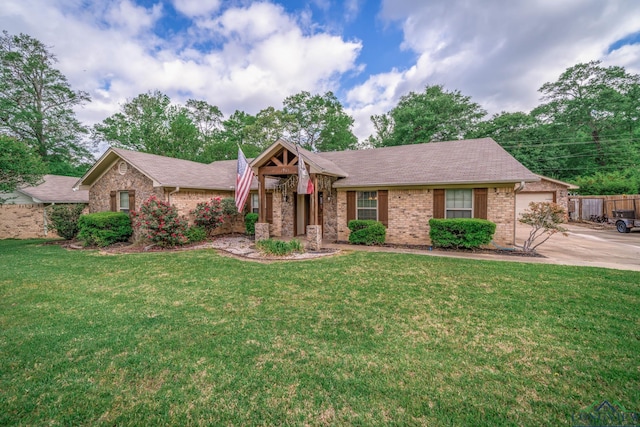 1901 Azalea St, Gilmer, TX 75644 - view of front of property with brick siding, a shingled roof, a front yard, and concrete driveway