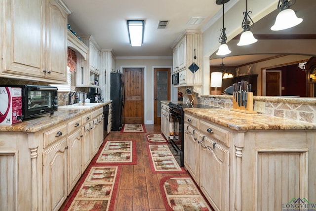 1901 Azalea St, Gilmer, TX 75644 - kitchen featuring hardwood / wood-style flooring, black appliances, decorative backsplash, and visible vents