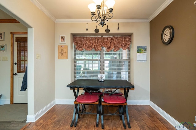 1901 Azalea St, Gilmer, TX 75644 - dining room featuring crown molding, an inviting chandelier, and dark wood finished floors