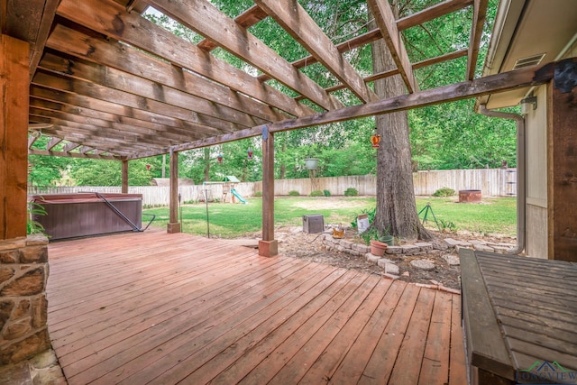 1901 Azalea St, Gilmer, TX 75644 - wooden terrace featuring a lawn, a hot tub, a fenced backyard, and a playground