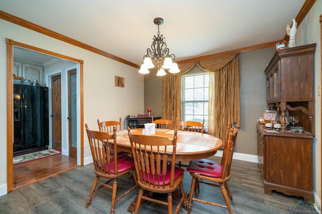 1901 Azalea St, Gilmer, TX 75644 - dining area with crown molding, baseboards, dark wood-style flooring, and a chandelier
