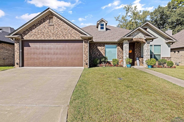 view of front of house with a front lawn and a garage