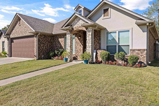 view of front of property with a garage and a front lawn