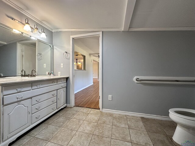 587 Floyd Evans Rd, Marshall, TX 75672 - bathroom with tile patterned flooring, toilet, vanity, and baseboards